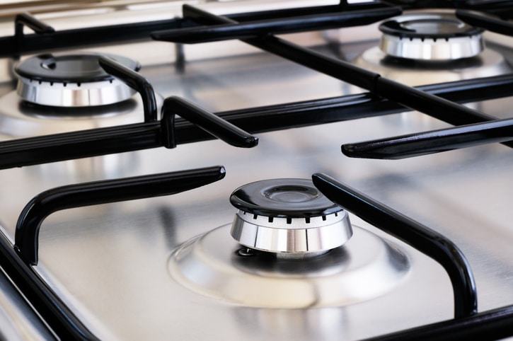 Clean stainless steel gas stove with multiple burners