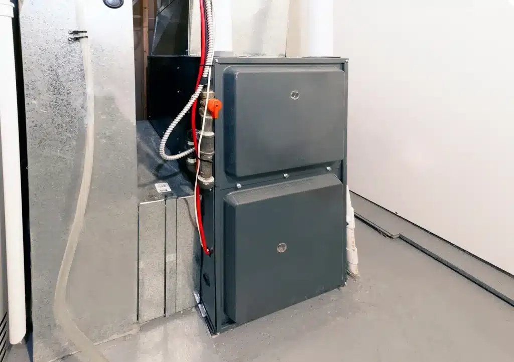 Newly installed high-efficiency furnace connected to ductwork and gas supply