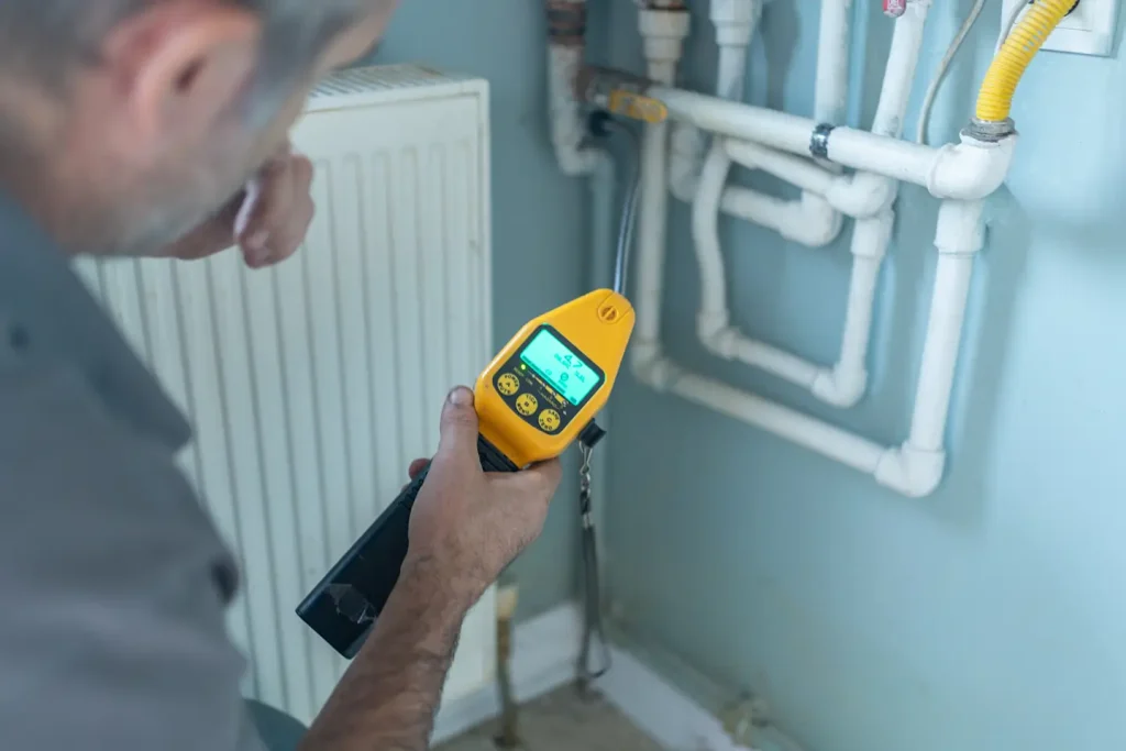 Gas leak and carbon monoxide detector used during furnace safety inspection