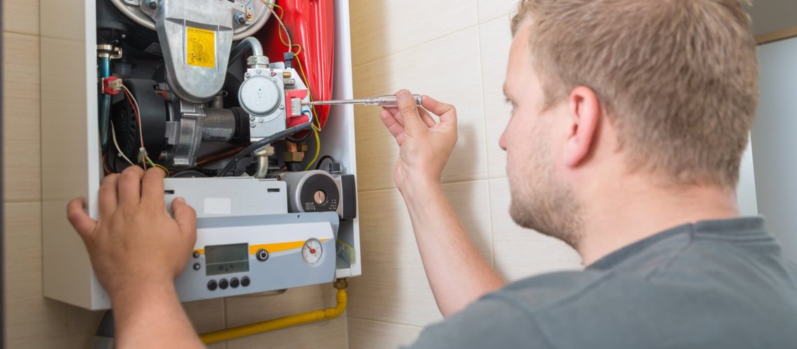 Technician repairing Gas Furnace