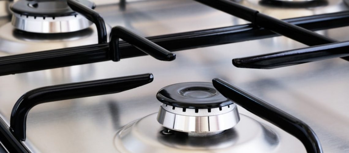 Clean stainless steel gas stove with multiple burners